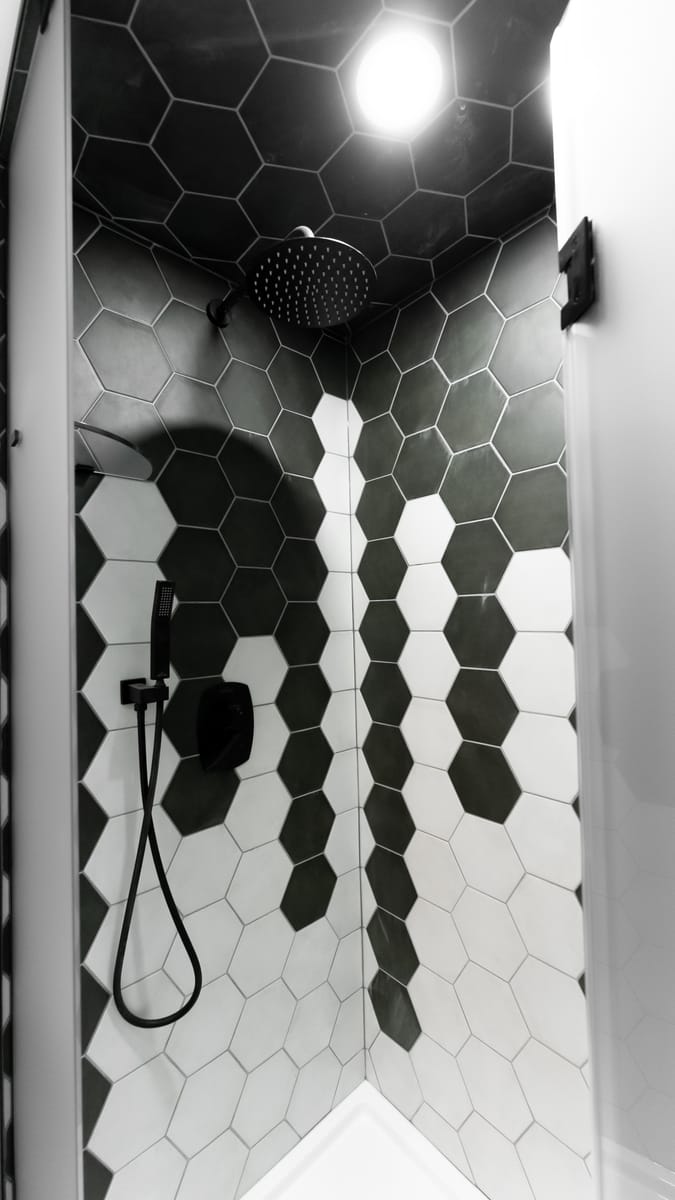 Black and white hexagon tile shower